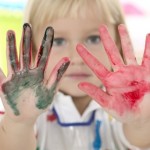 Girl with Paint on Her Hands